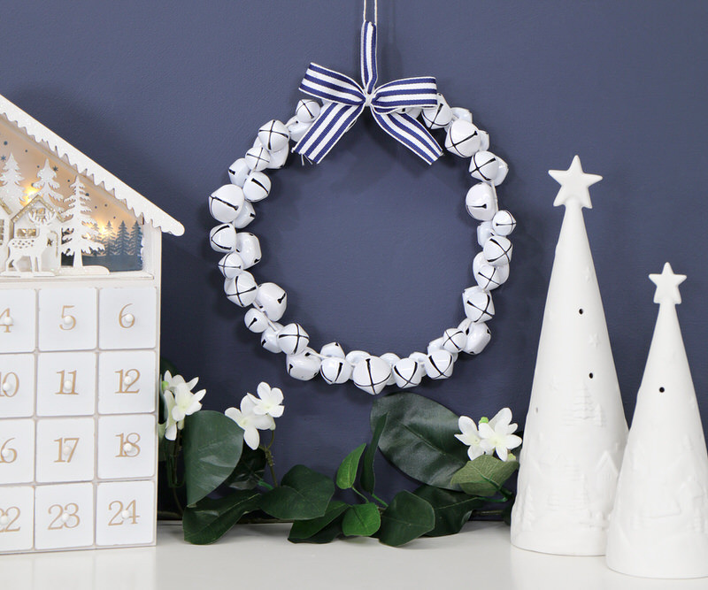 White Jingle Bell Wreath with Blue Bow
