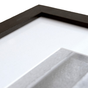 Close up view of black A3 picture frame detail and white mat boarder