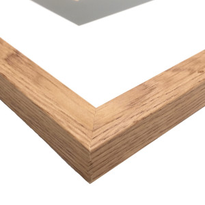 Close up view of American Oak A3 frame with white mat and acrylic front
