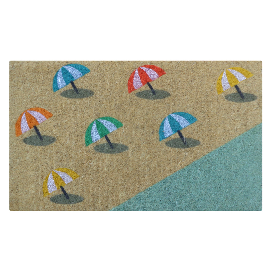 Natural coir doormat with colourful beach umbrellas beside a shoreline
