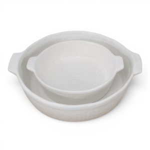 Small off-white speckled ceramic baking dish nested inside the matching large dish