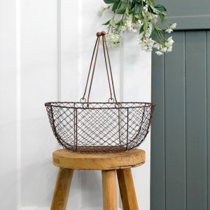 Medium Wickford Wire Basket, designed as a versatile storage accent for an interior space
