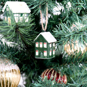 Holly Lane green house bauble styled on a Christmas tree with another green house and red and gold ornaments