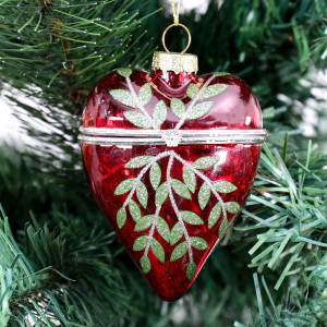 Rosalie red glass heart bauble with green leaves and a silver-coloured metal band hanging on a Christmas tree