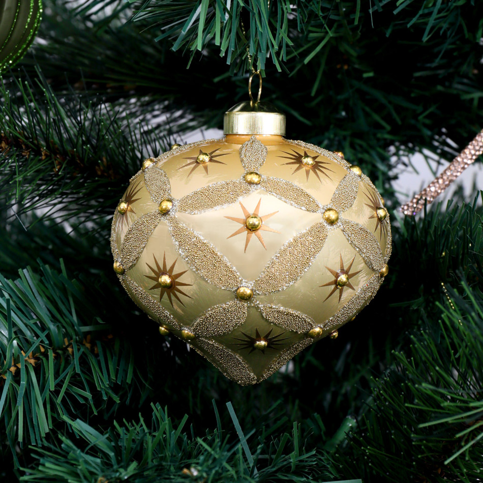 Close-up of the gold star and beaded diamond details on Seraphina onion decoration hanging on a Christmas tree