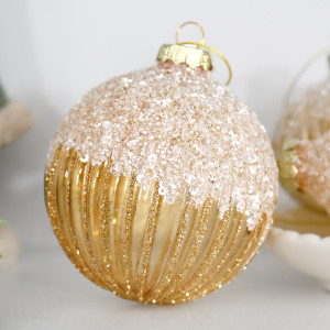 Close-up of the sparkling beaded top and gold glitter ribs on a Francesca round glass bauble