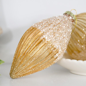 Close-up of a Francesca gold glass teardrop bauble with glittered ribs and a sparkling beaded top