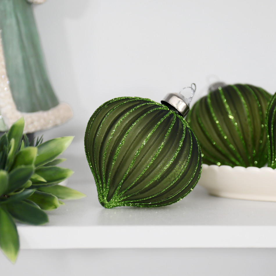 Marissa green onion bauble displayed beside matching ornaments, greenery and a green Santa figure
