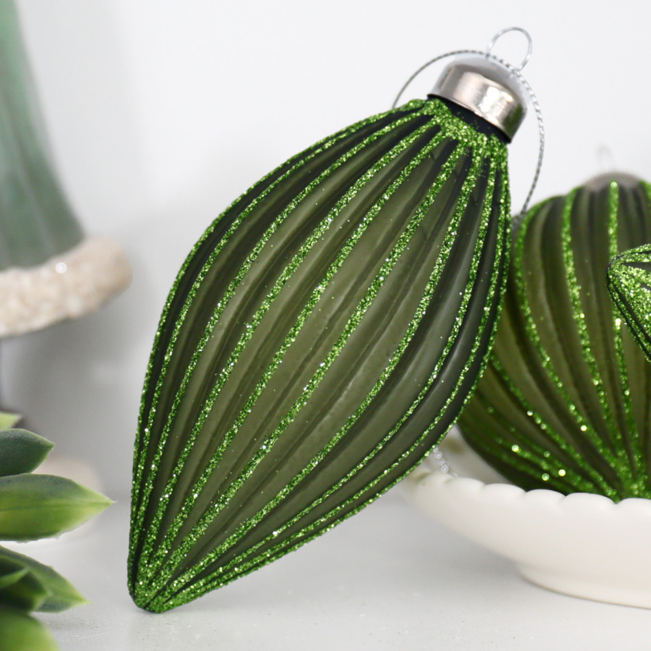 Close-up of a Marissa green glass teardrop bauble with fluted glitter detailing and a silver cap
