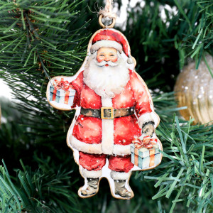 Close-up of vintage-style metal Santa decoration holding pale blue gifts on a Christmas tree