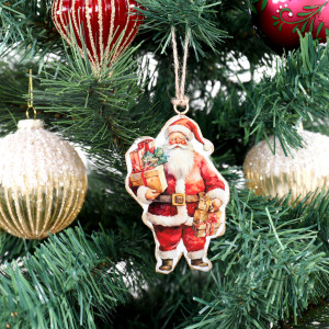 Metal Santa Christmas decoration hanging among red and gold baubles on green tree branches