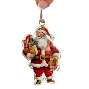 Vintage Tin Santa I decoration held by its twine hanging loop against a white background