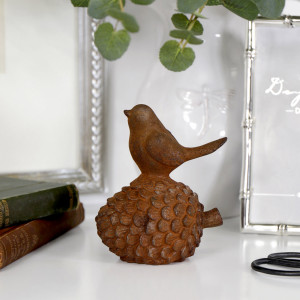 Redbridge Rusty Iron Bird on Pine Cone, highlighting the product's distinctive form and defining design