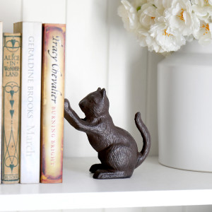 Orwell Cast Iron Cat Bookend, a decorative support designed to keep books upright and organised