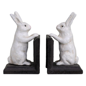 Front view of the two white bunny bookends with dark brown L-shaped bases on a white background