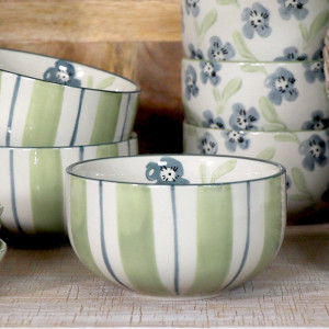 Isobel Green Stripe Bowl, a tabletop piece suited to serving food or creating a decorative display