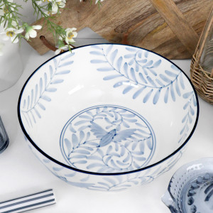 Top view of the Larkspur blue and white ceramic bowl with handpainted leafy details and a dark blue rim