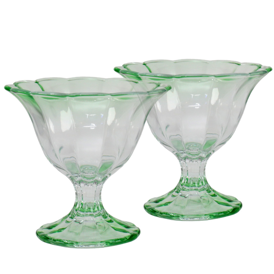 Set of two translucent green glass dessert bowls with fluted sides, scalloped rims and pedestal bases