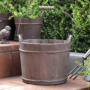 Large reclaimed fir wood barrel bucket with dark metal bands and a carry handle