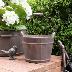 Medium Hartwell Barrel Bucket shown with its wooden handle raised
