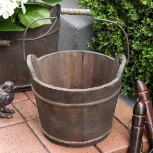 Medium rustic wooden bucket presented from an alternate angle