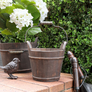 Small Hartwell Barrel Bucket shown with its wooden handle raised