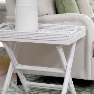 Close-up of the white woven tray and curved rattan handles