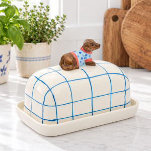 Hugo Dog Butter Dish styled on a kitchen bench with blue and white accessories