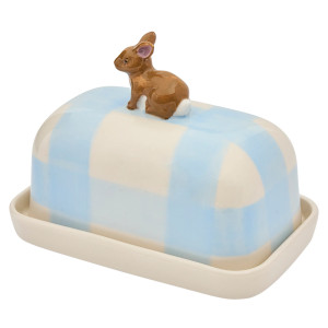 Rear angled view of porcelain rabbit butter dish with blue and cream check lid