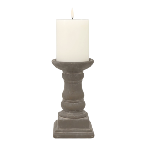 Short Elstead grey cement candle holder shown with an ivory pillar candle