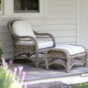 Camden rattan armchair and matching footstool arranged on a covered verandah