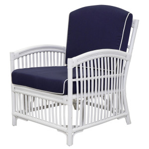 Marina white rattan armchair with navy piped cushions shown from the front and side