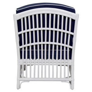 Rear view of the Marina armchair showing its white vertical rattan cane back