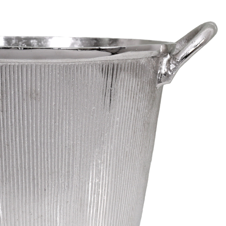 Close-up of the silver champagne bucket showing its ribbed texture, smooth rim and curved handle