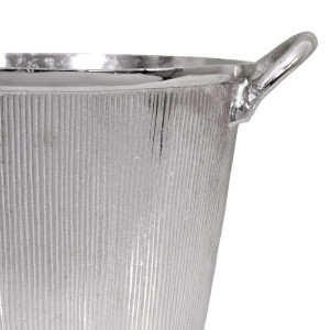 Close-up of the silver champagne bucket showing its ribbed texture, smooth rim and curved handle