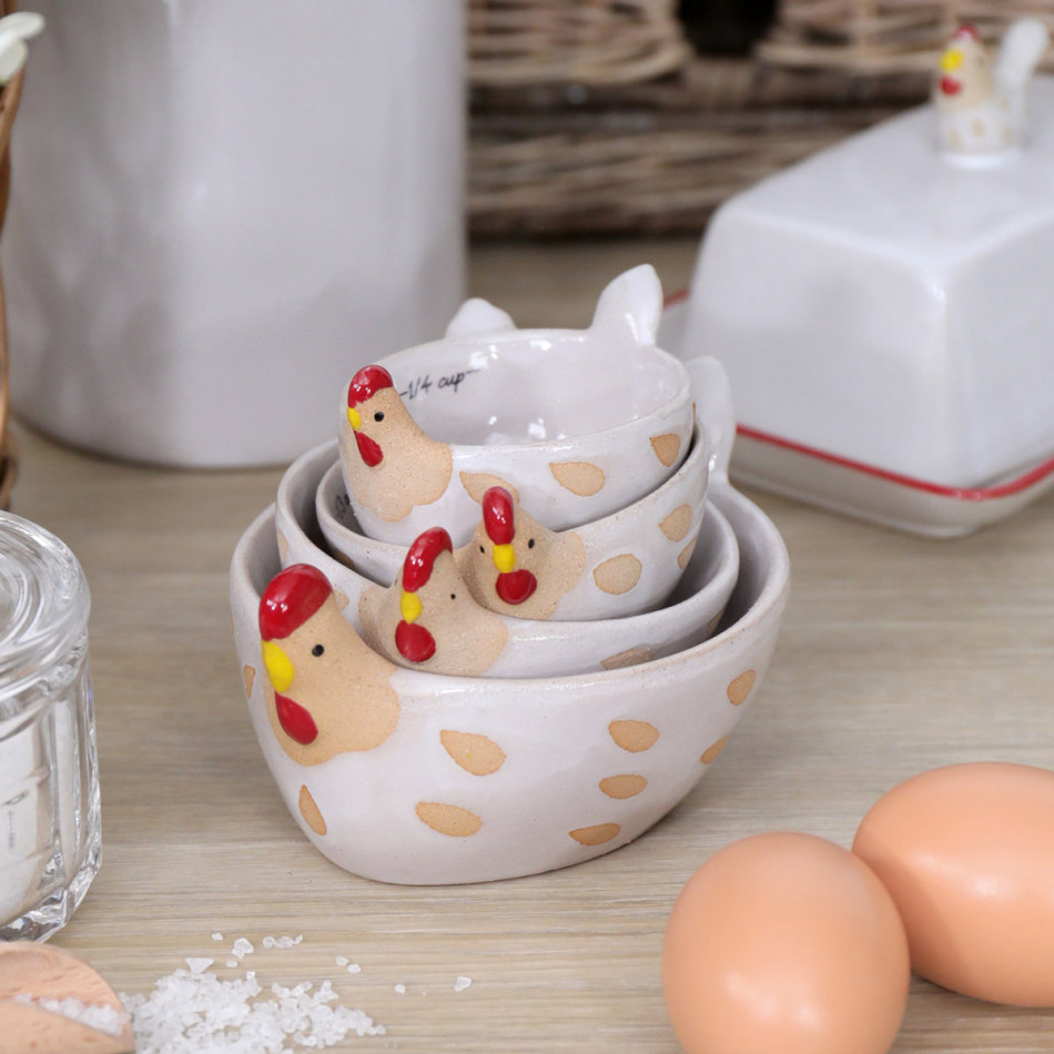 The Little Red Hen Measuring Cups, a drinkware piece designed for serving beverages at the table