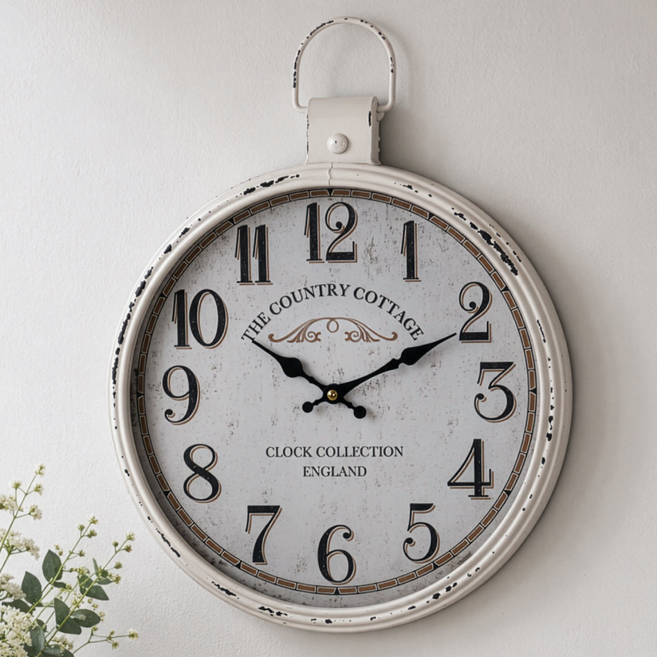 Rustic white stopwatch-style wall clock displayed above a vase of white flowers