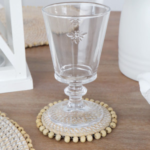 Set 4 Avoca Whitewash Rattan Coasters, a tabletop accessory designed to protect surfaces from drinkware