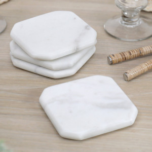 Set 4 Melita White Marble Coasters, a tabletop accessory designed to protect surfaces from drinkware