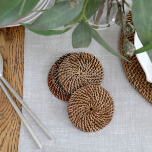 Set 4 Newport Brown Rattan Coasters, a tabletop accessory designed to protect surfaces from drinkware