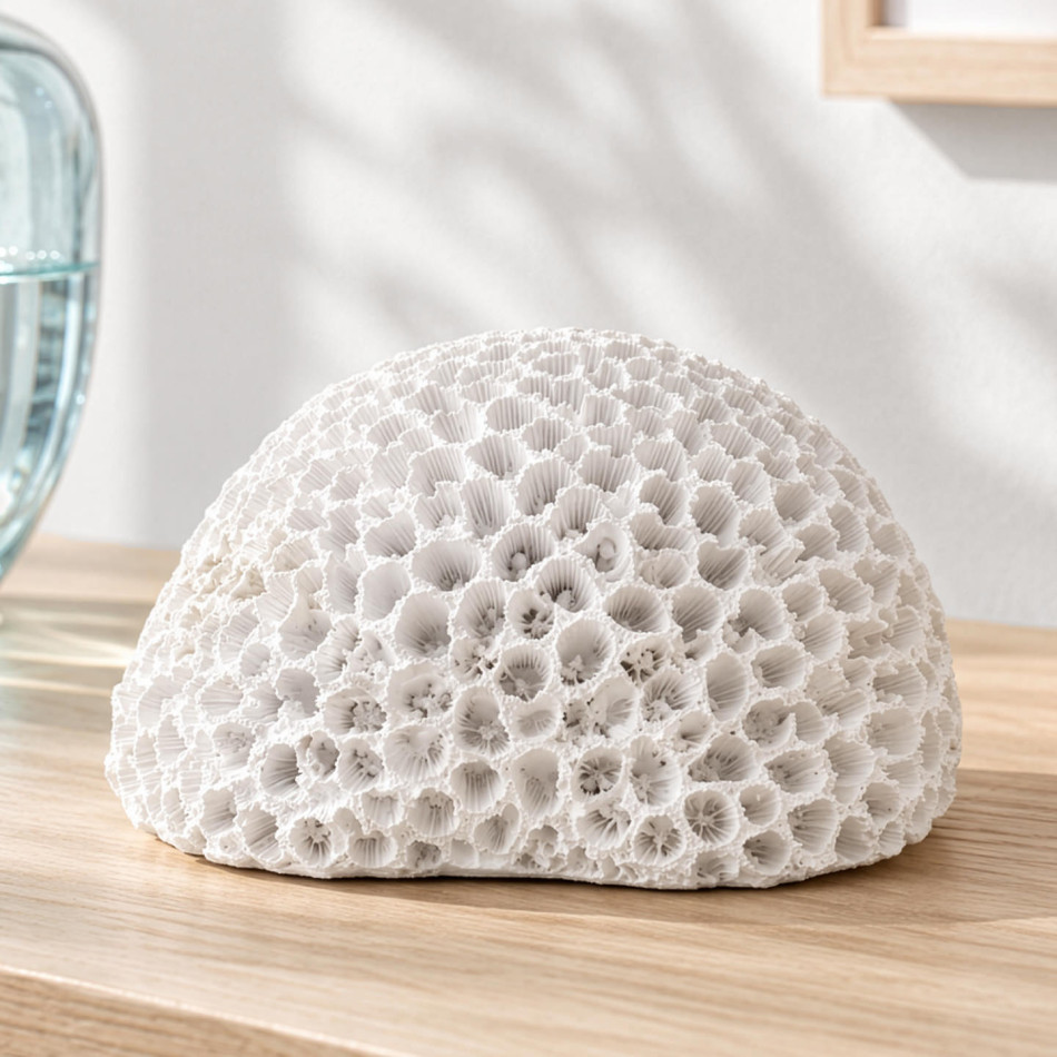 Close-up of white Hayman faux brain coral on a timber surface, showing its detailed ridges and hollows