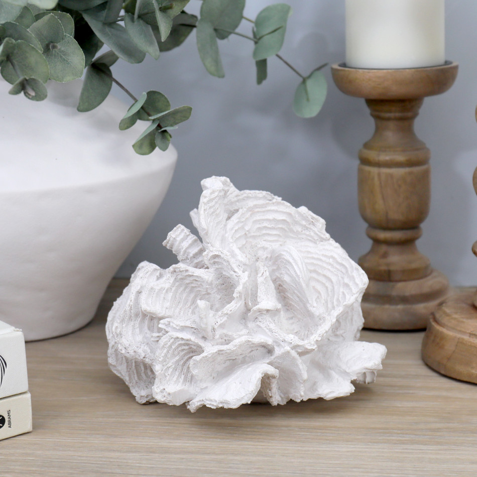 White foliose coral sculpture with a vase and candle holders