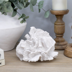 White foliose coral sculpture with a vase and candle holders