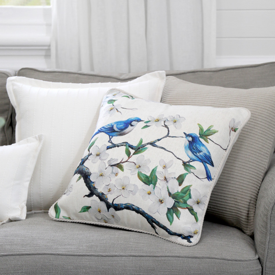 Eliza Blossom Blue Wrens Cushion, shown as a soft decorative accent for layering on seating or a bed
