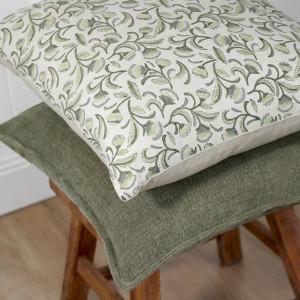 Hudson Chambray Cushion - Moss Green, shown as a soft decorative accent for layering on seating or a bed