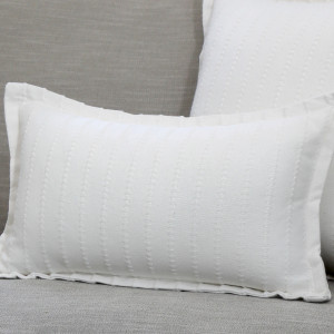 Lumbar Novara White Ribbed Cushion, shown as a soft decorative accent for layering on seating or a bed
