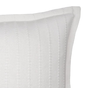 Novara White Ribbed Cushion 50cm, shown as a soft decorative accent for layering on seating or a bed