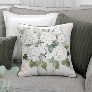 Audrey White Hydrangeas Cushion, shown as a soft decorative accent for layering on seating or a bed