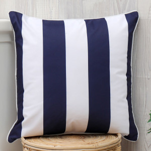 Navy and white striped outdoor cushion adding colour and texture to a seating arrangement