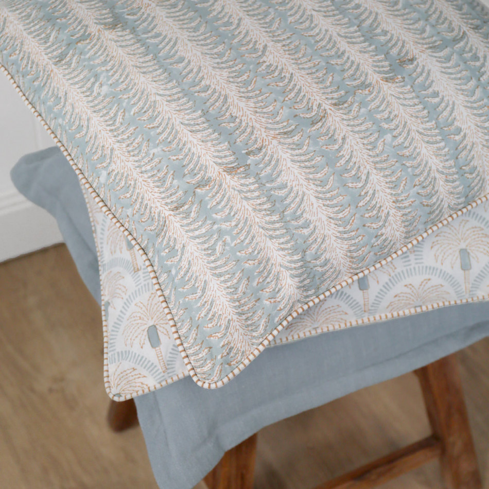 Palmetto Reversible Coastal Blue Cushion, a decorative soft furnishing for a sofa, chair or bed